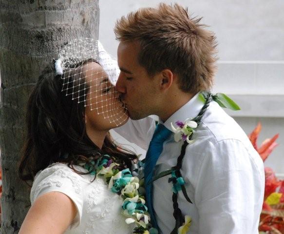 Bride and Groom Kissing in Hawaiian Wedding Leis 